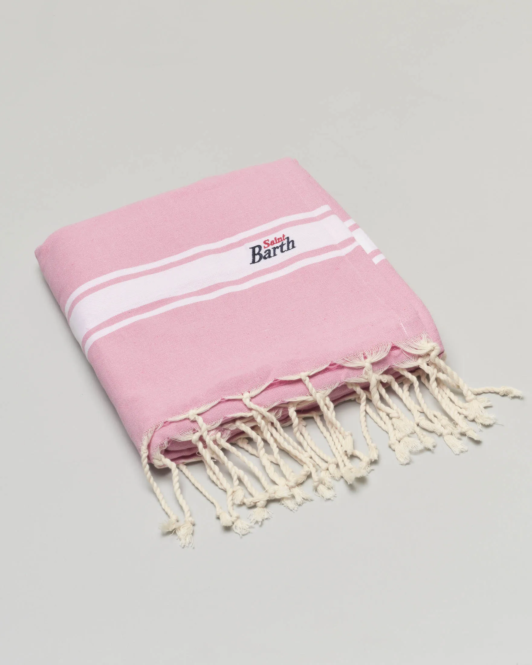 Telo mare rosa in spugna di cotone con riga bianca e scritta logo ricamata a contrasto di colore